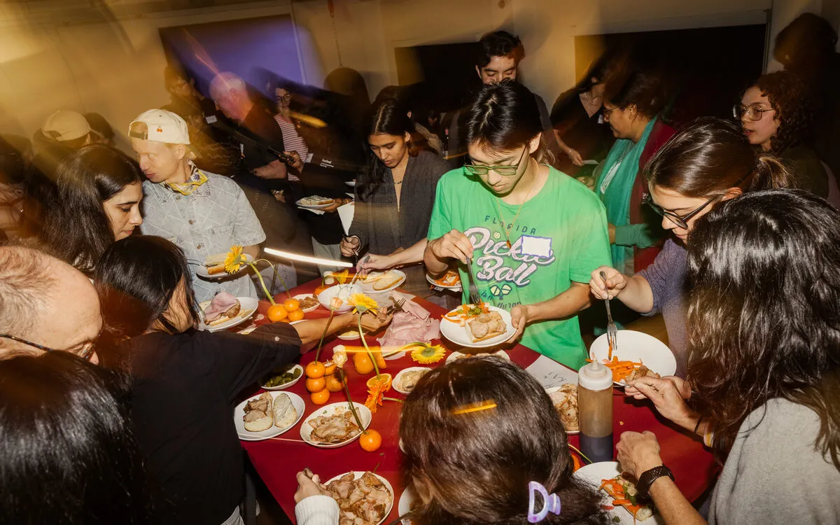 Guests sharing a meal at the Tending the Us dinner